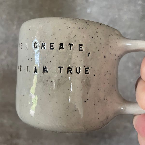 Ceramic mug with artist quote