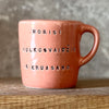 Small pink mug with funny phrase in Lithuanian