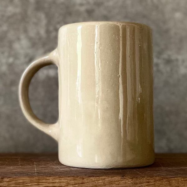 Beige mug with love saying in Lithuanian