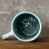 Blue ceramic mug with word PASITIKĖK