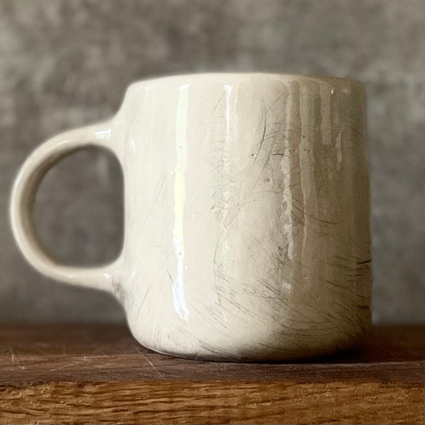 White medium ceramic mug with words about work
