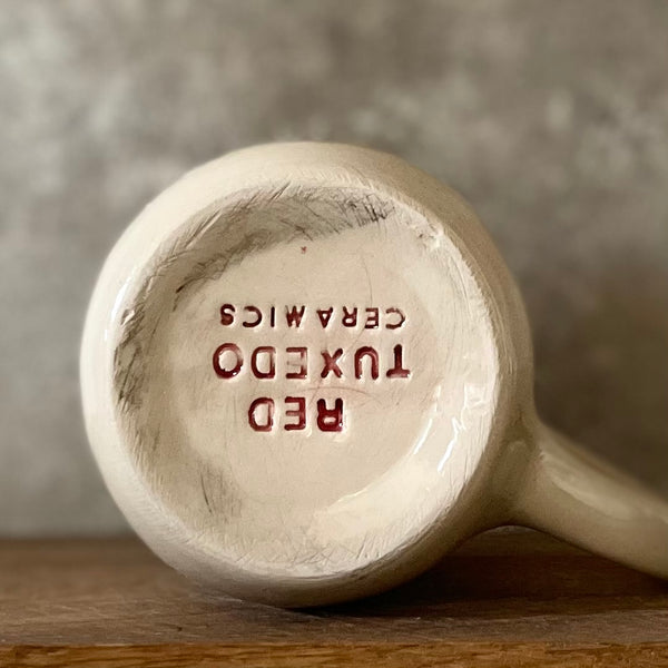 Ceramic mug with funny saying about money