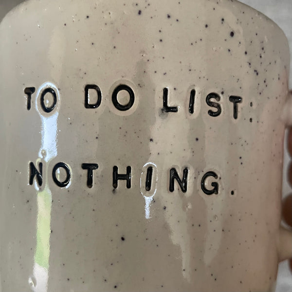 Speckled mug with cozy saying
