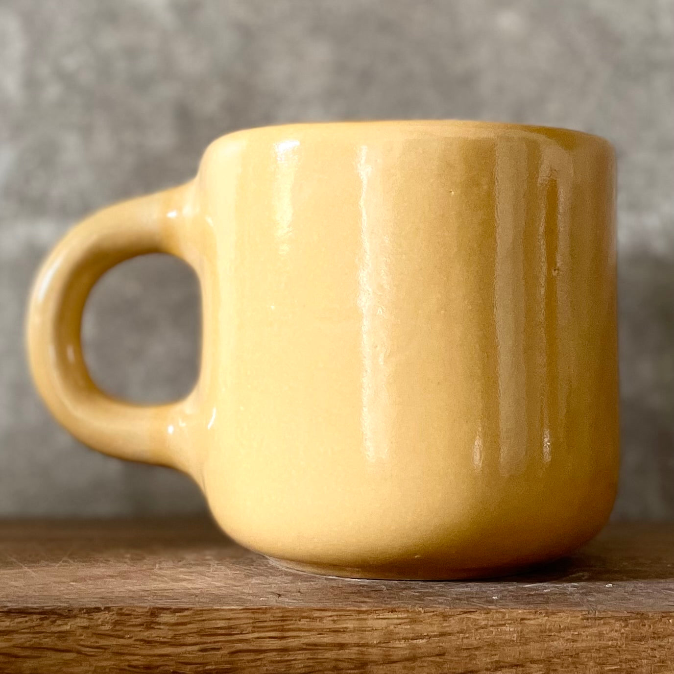 Yellow mug with optimistic text