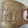 Brown mug with quote by S. Freud