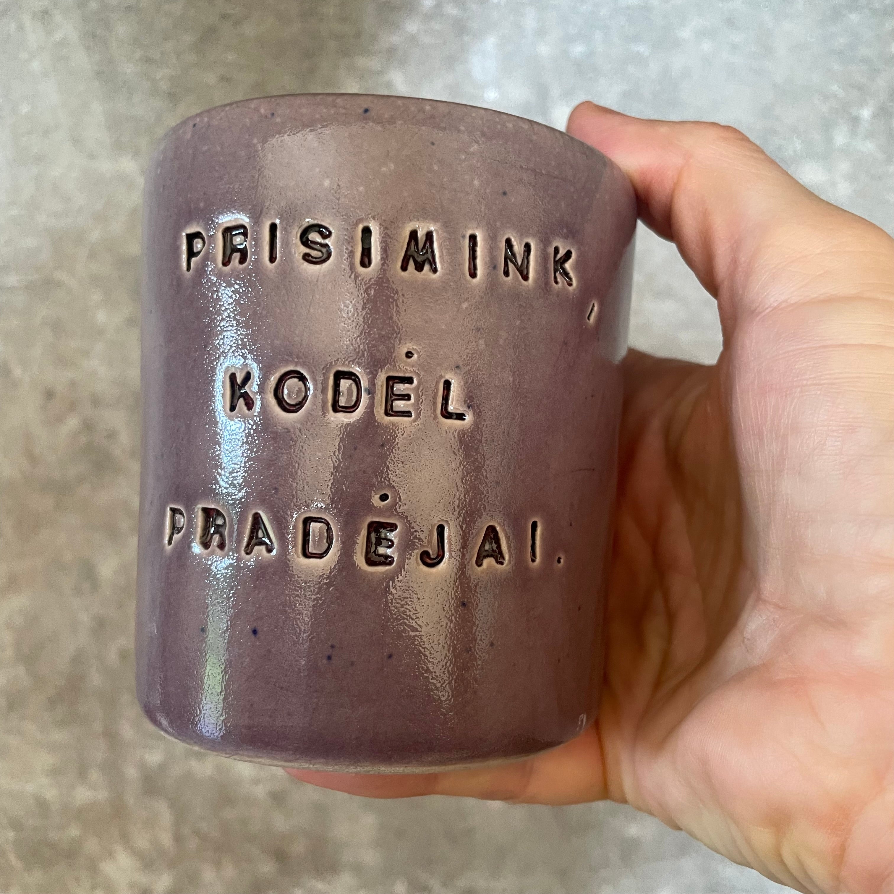 Purple mug with saying in Lithuanian