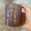 Purple mug with saying in Lithuanian