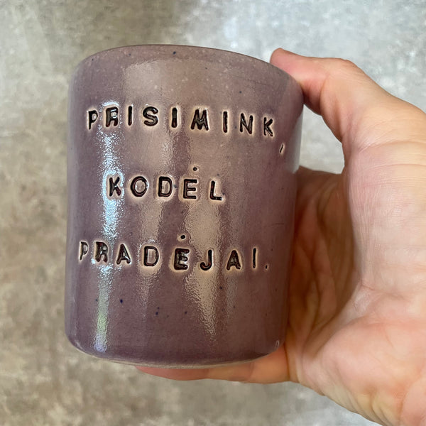 Purple mug with saying in Lithuanian
