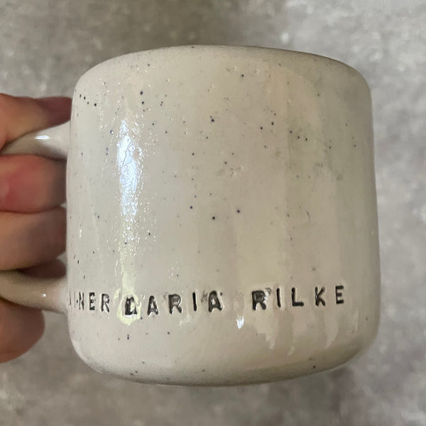 Ceramic mug with artist quote