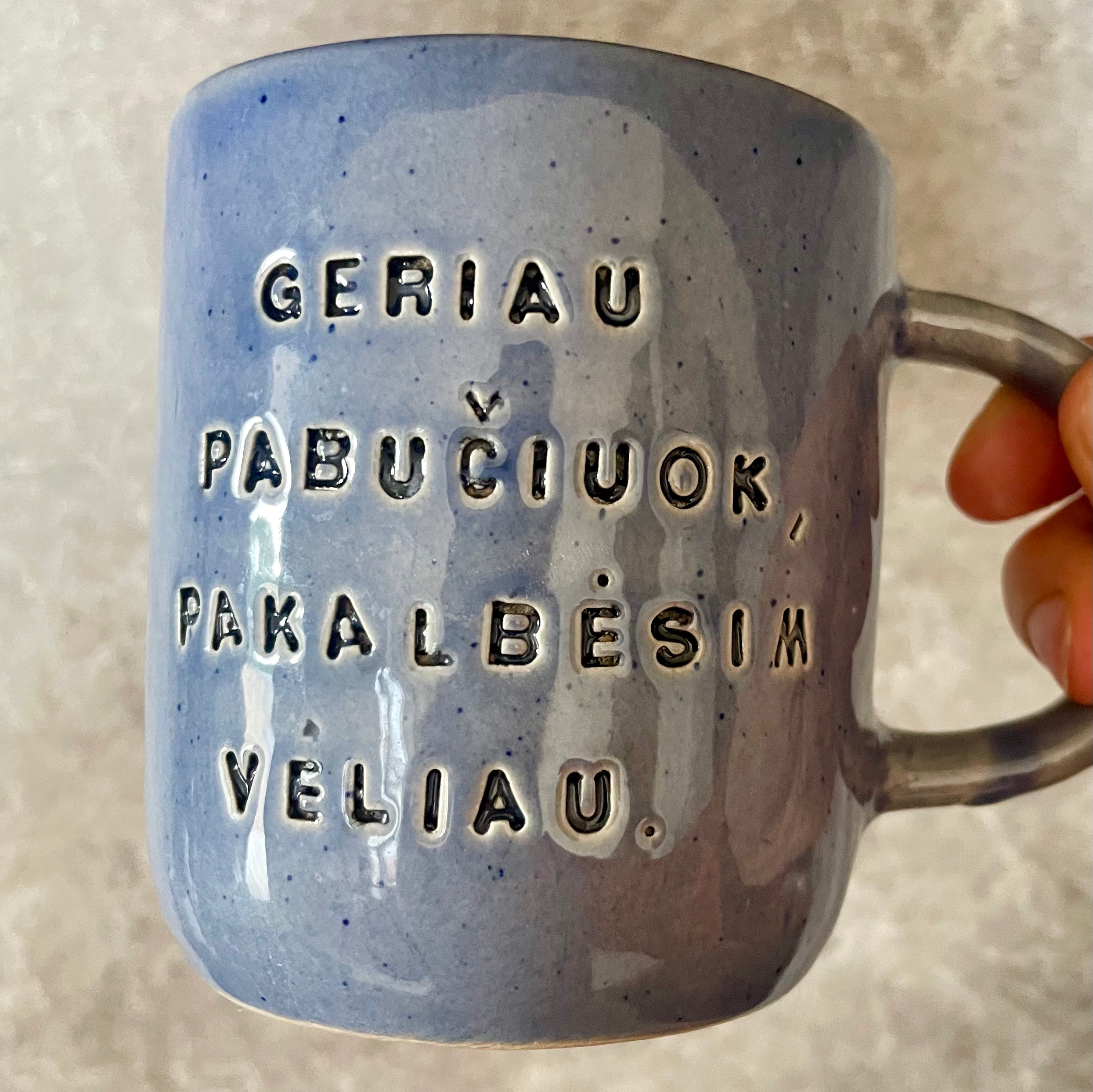 Blue ceramic mug with love words