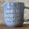Blue ceramic mug with love words