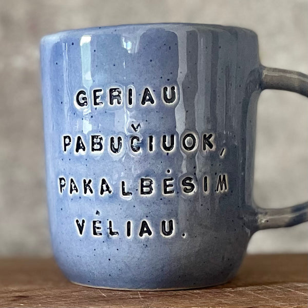 Blue ceramic mug with love words