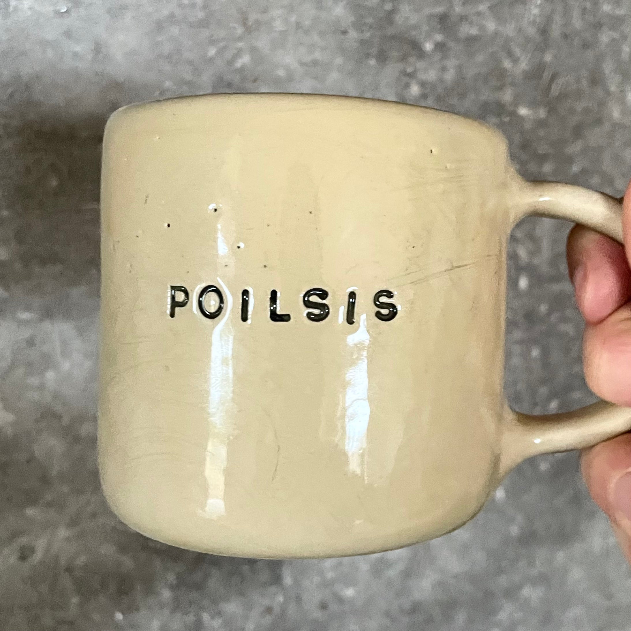 Ceramic mug with word POILSIS