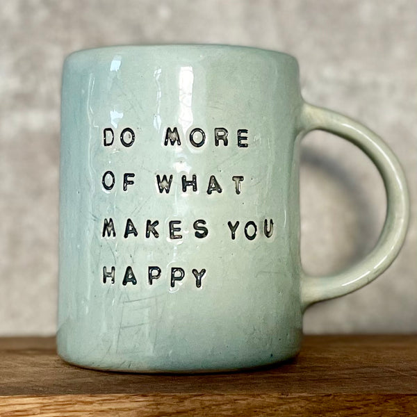 Pale blue coffee mug with inspirational saying