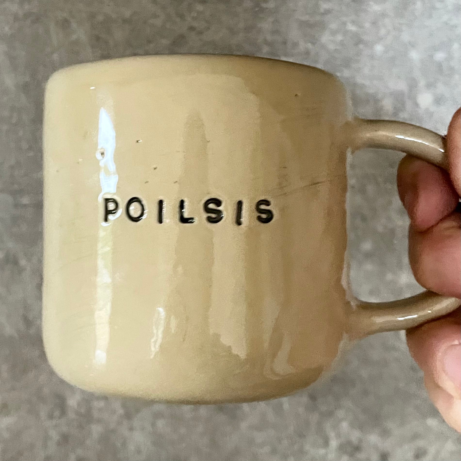 Ceramic mug with word POILSIS