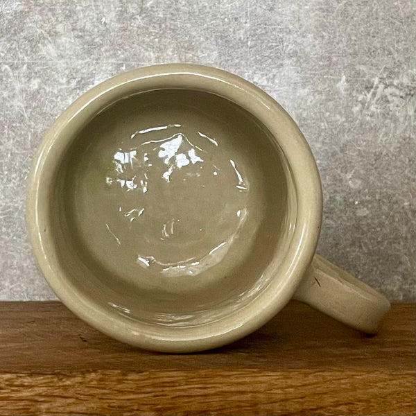 Big yellow mug with funny phrase in Lithuanian