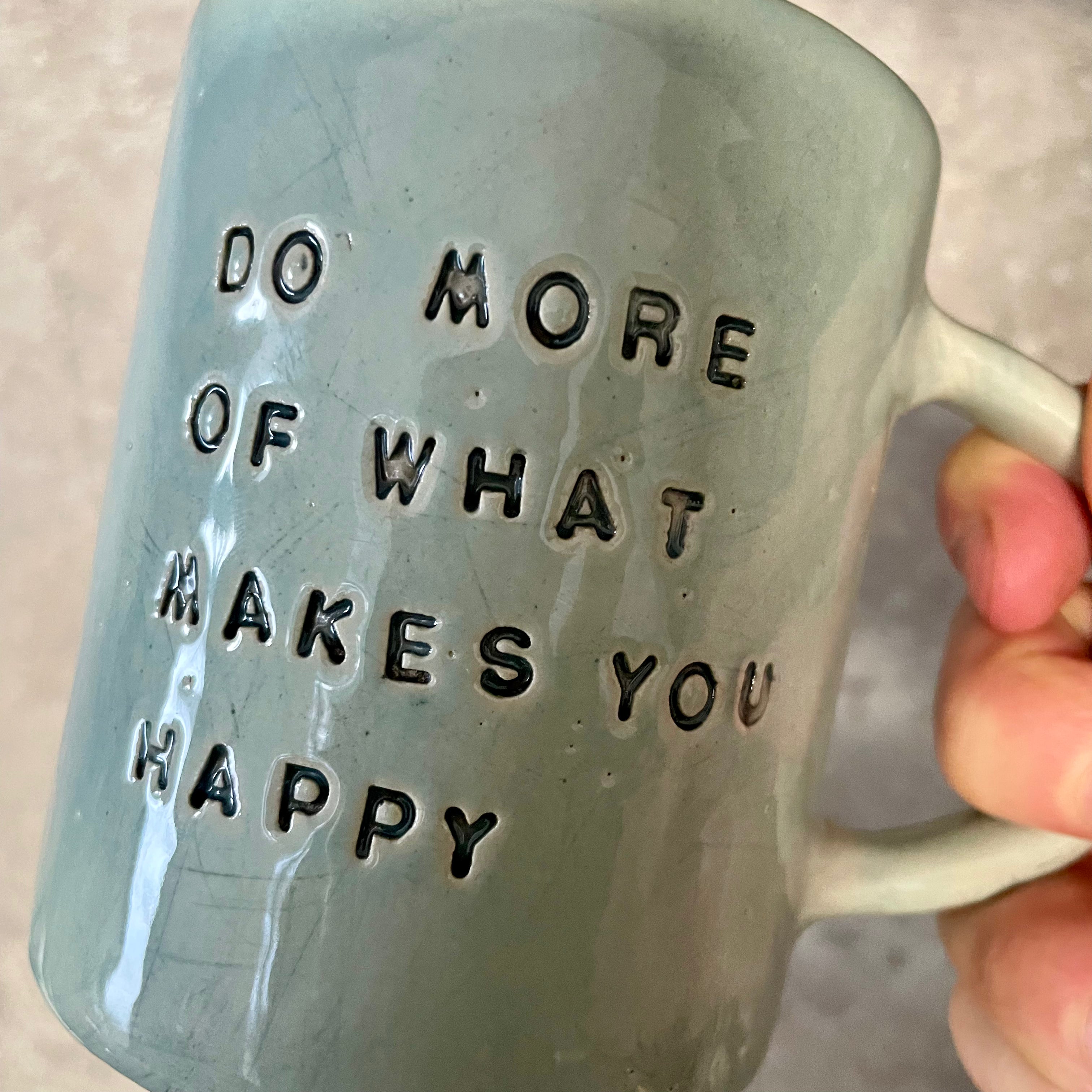 Pale blue coffee mug with inspirational saying