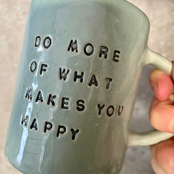Pale blue coffee mug with inspirational saying