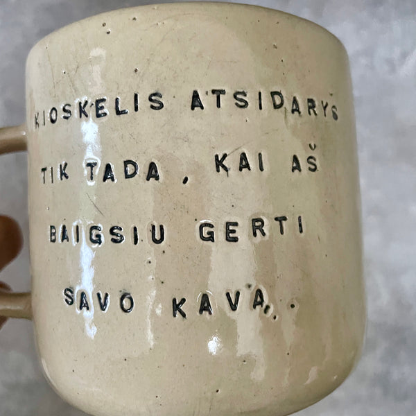 Big yellow mug with funny phrase in Lithuanian