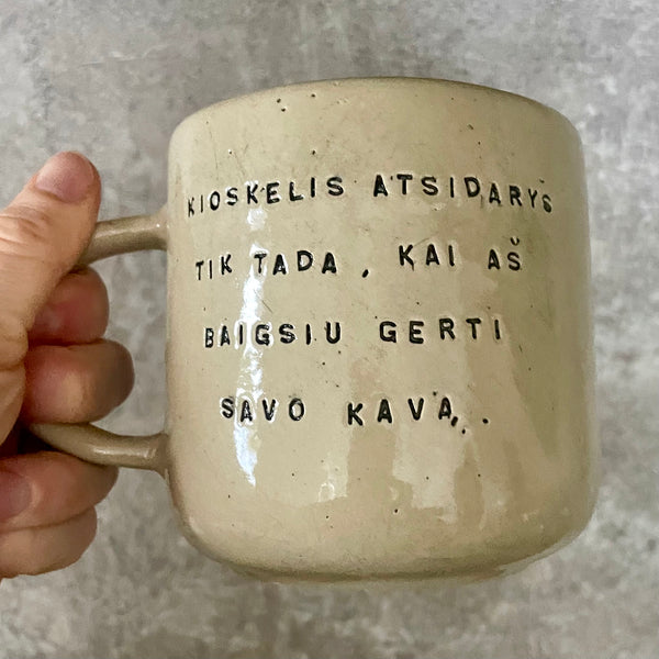 Big yellow mug with funny phrase in Lithuanian