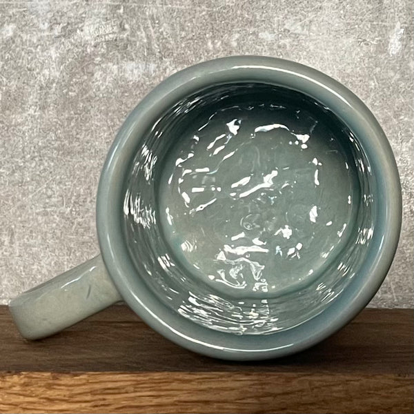 Pale blue coffee mug with inspirational saying