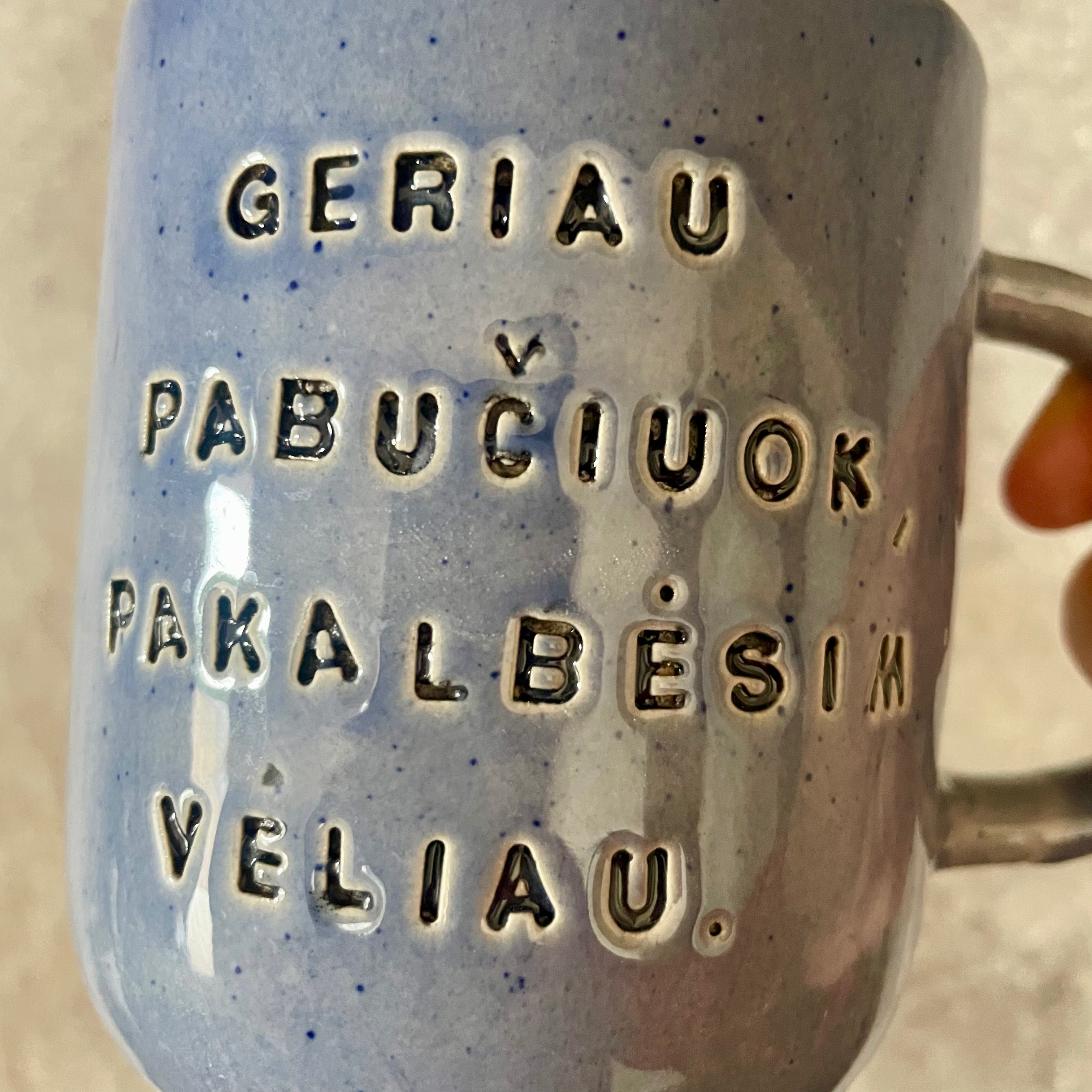 Blue ceramic mug with love words