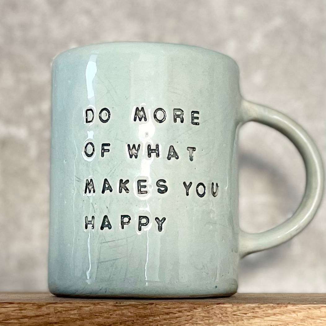 Pale blue coffee mug with inspirational saying