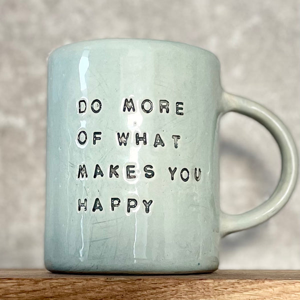 Pale blue coffee mug with inspirational saying