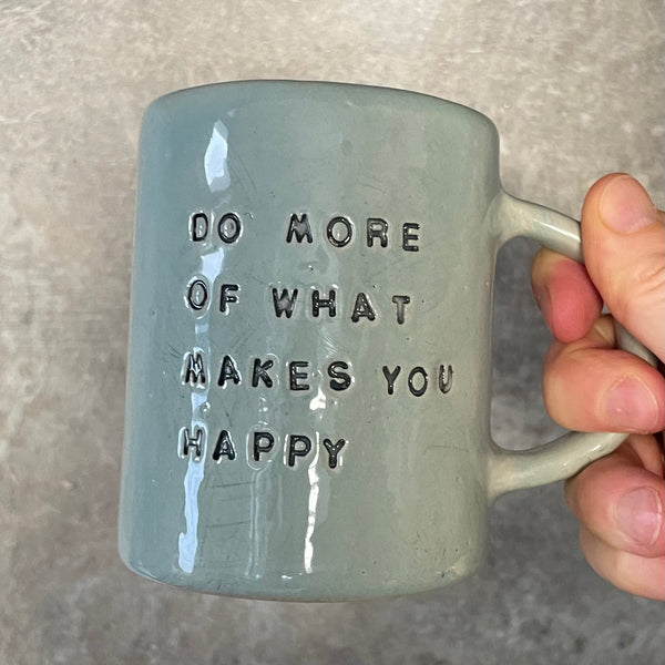 Pale blue coffee mug with inspirational saying