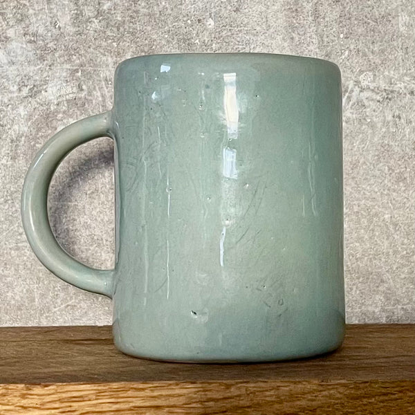 Pale blue coffee mug with inspirational saying