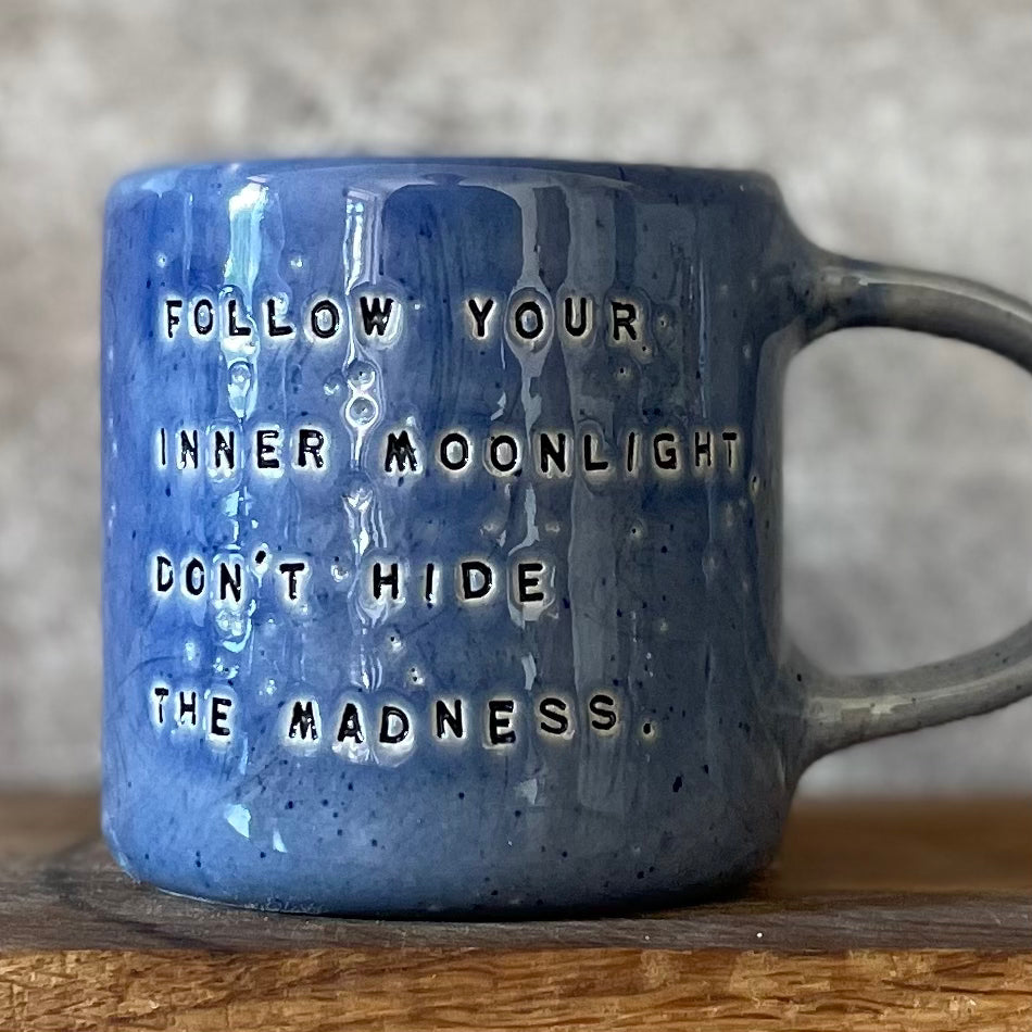 Blue ceramic coffee mug with quote