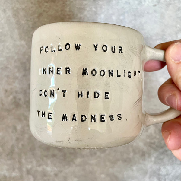 Ceramic coffee mug with writer quote