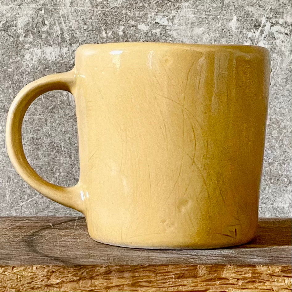 Yellow cup with saying