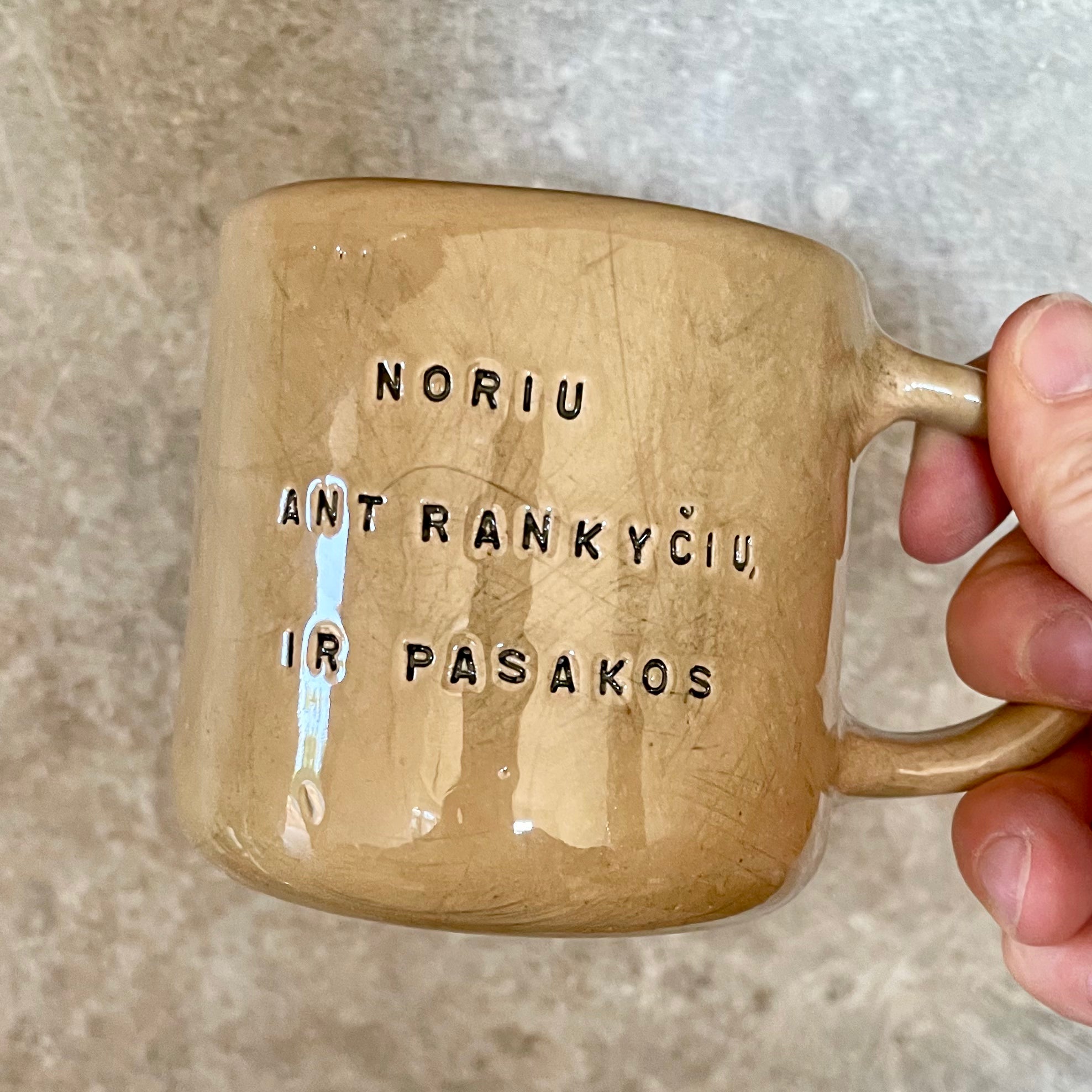 Brownish mug with sweet words in Lithuanian