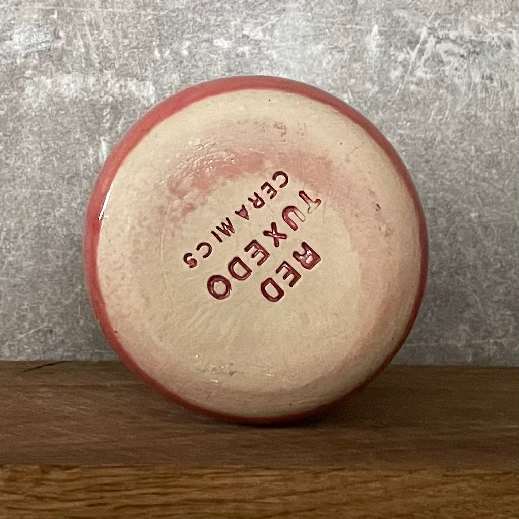 Rožinis puodelis be rankenos su vokišku užrašu