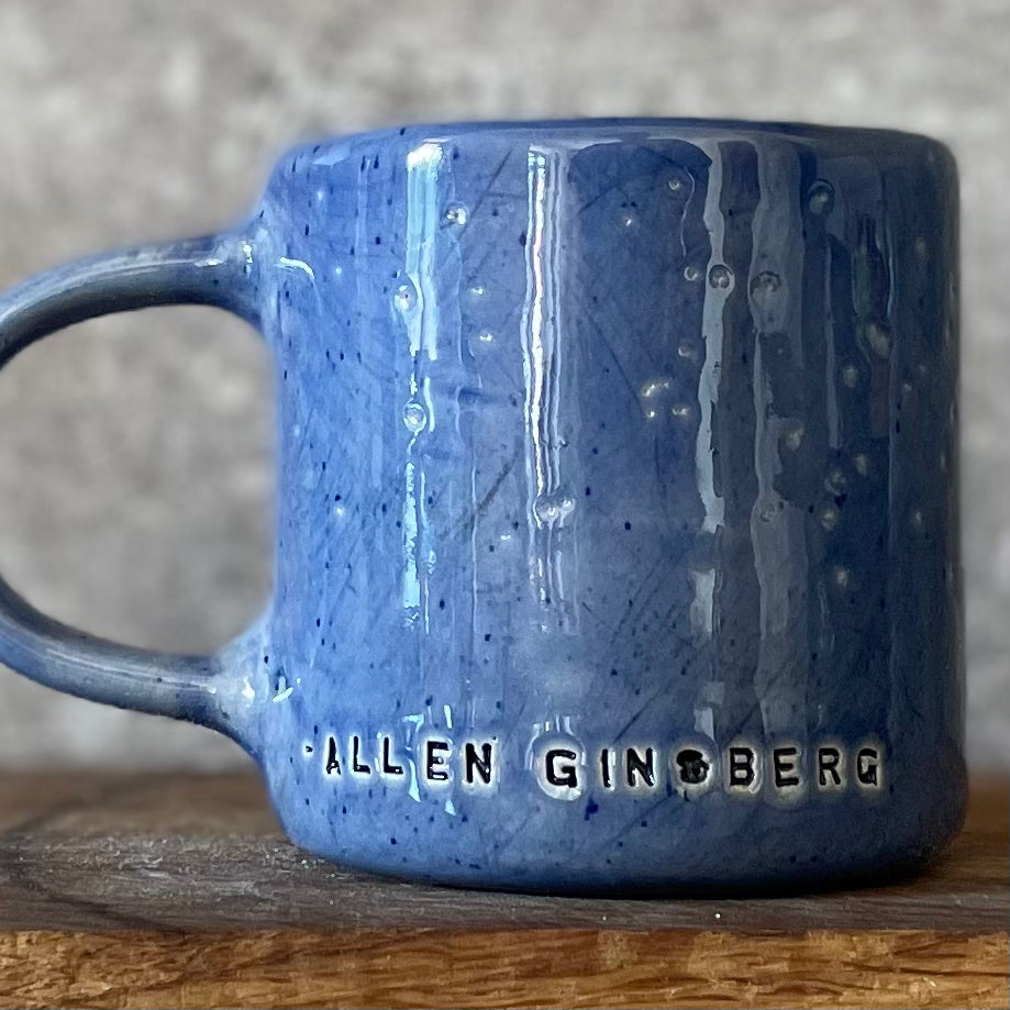 Blue ceramic coffee mug with quote
