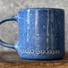 Blue ceramic coffee mug with quote