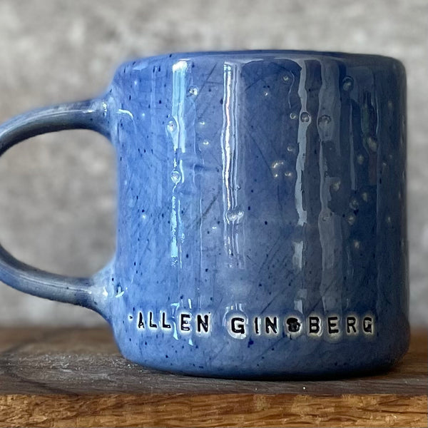 Blue ceramic coffee mug with quote