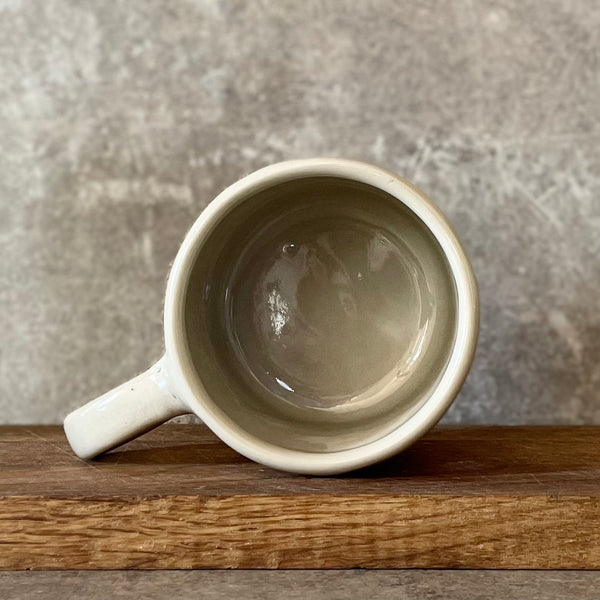 Ceramic coffee mug with writer quote