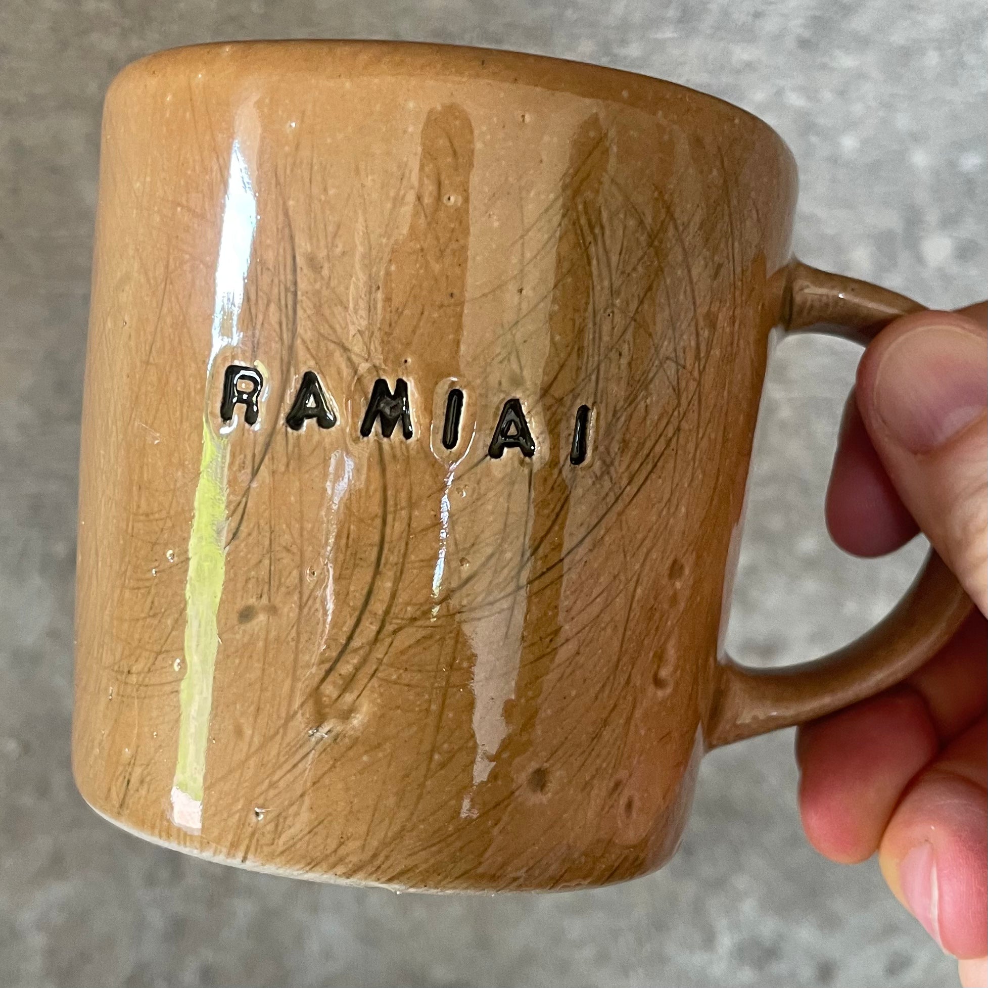Ceramic mug with word RAMIAI