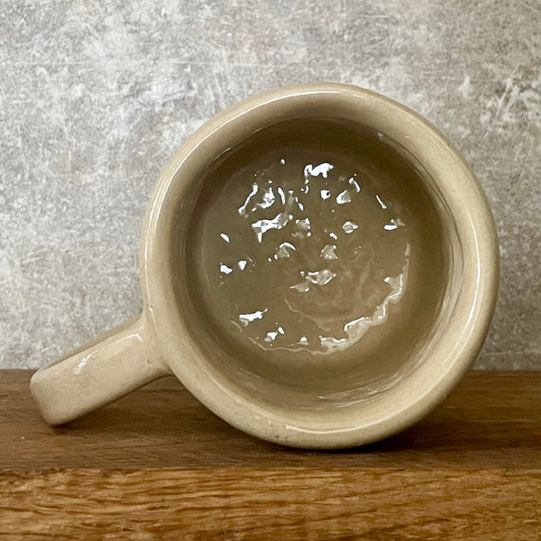 Rusvas puodelis DAR PAGULĖKIM