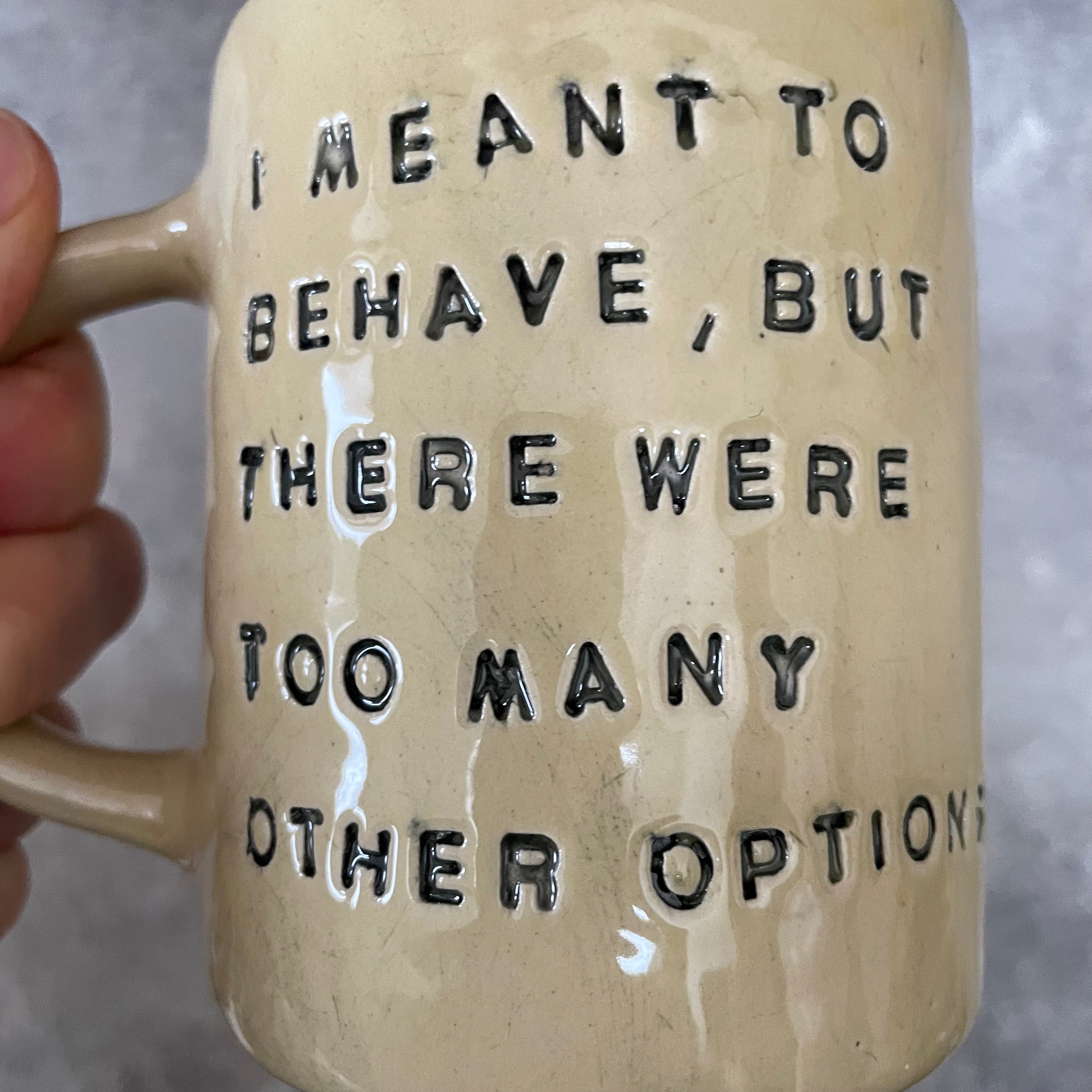 Yellowish coffee mug with funny saying