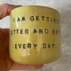 Yellow affirmation mug about healing and improving