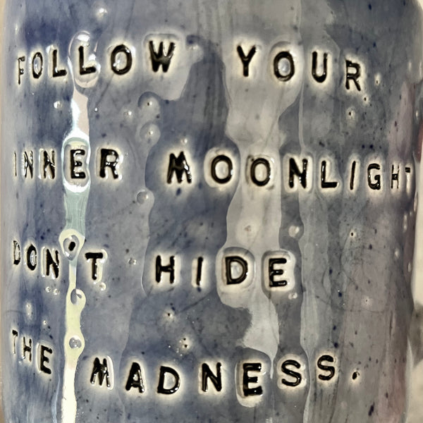 Blue ceramic coffee mug with quote