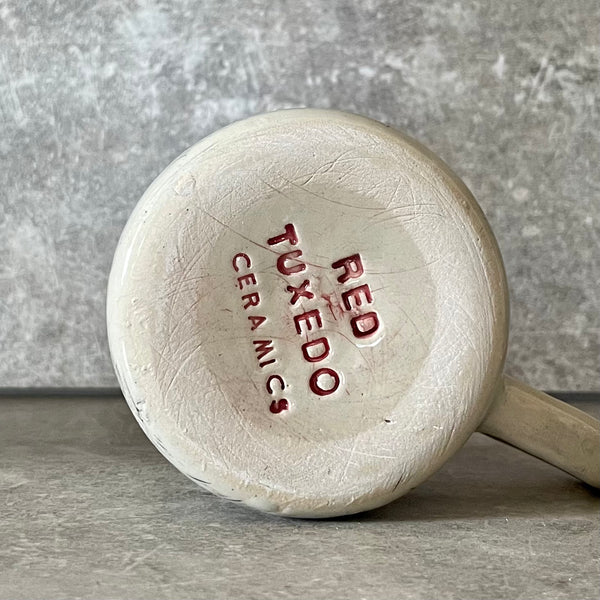 Keramikinis puodelis su Kafkos citata