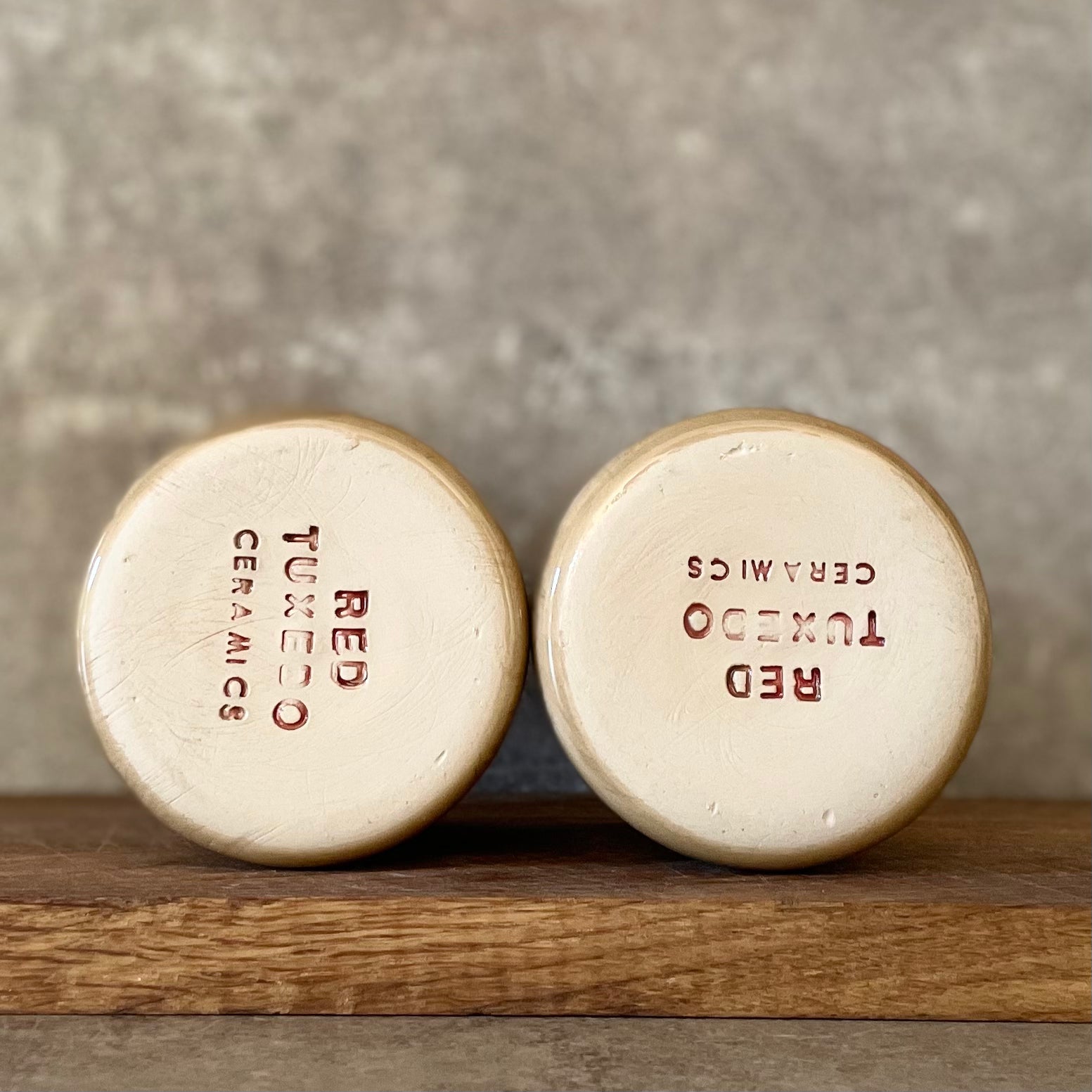 A pair of coffee mugs RELAX