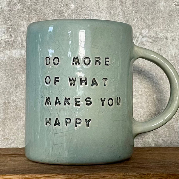 Pale blue coffee mug with inspirational saying