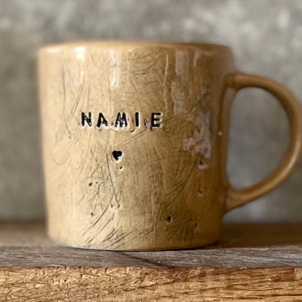 Caramel mug with word in Lithuanian NAMIE 🖤