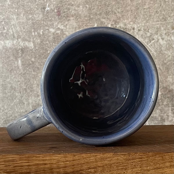 Blue ceramic mug with love words