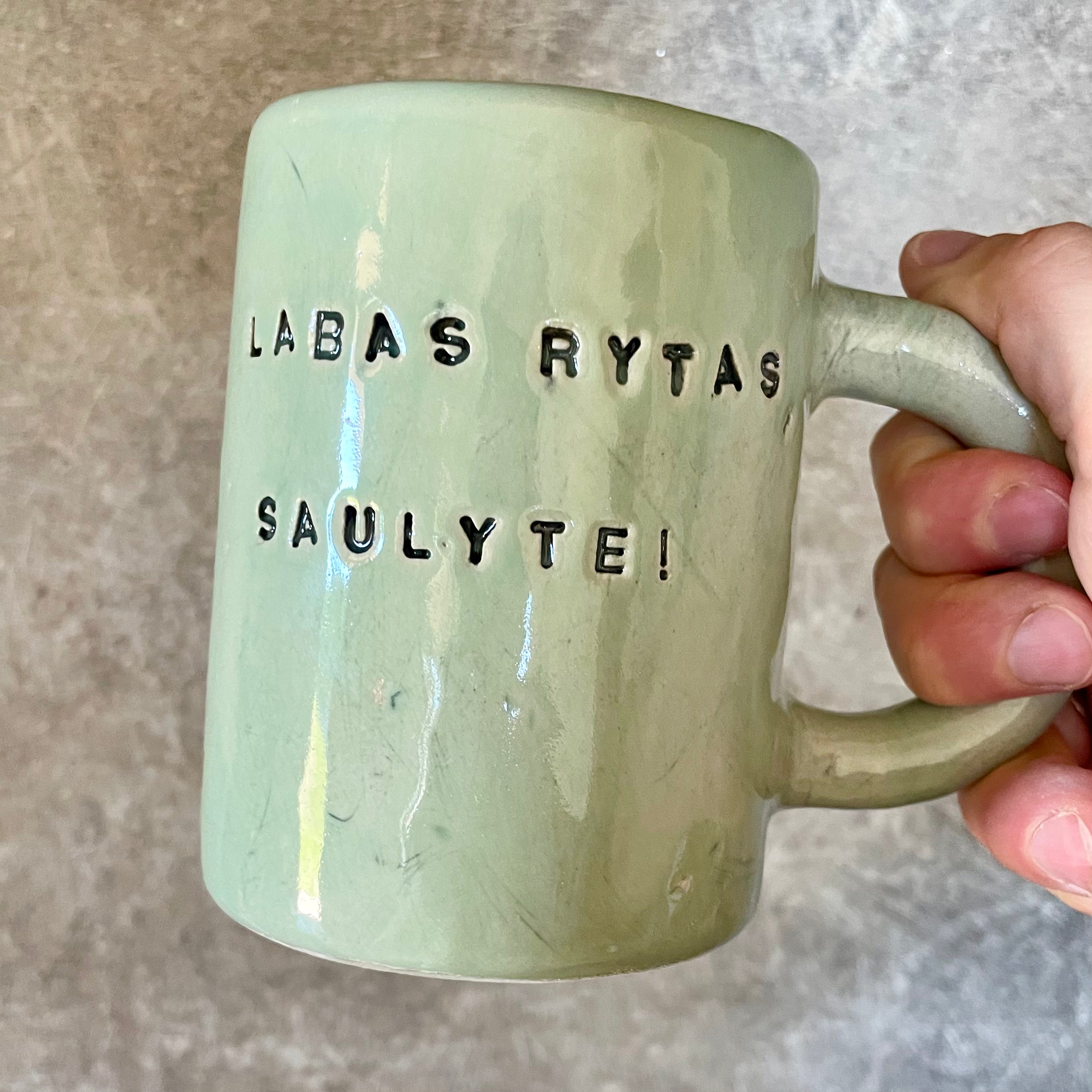 Ceramic mug with words in Lithuanian LABAS RYTAS, SAULYTE!